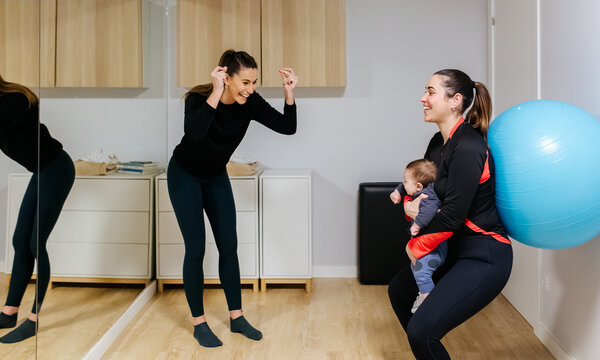 Mother and baby attending a postpartum recovery class