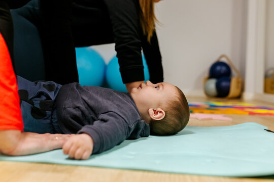 Mother and baby attending a postpartum recovery class