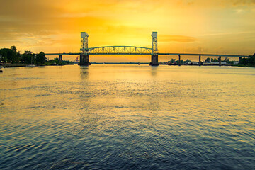 Cape Fear Memorial Bridge at Wilmington NC USA at sunset. - obrazy, fototapety, plakaty