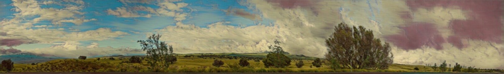 Rolling hills Outside of Kona Hawaii, with blue skies and green grass and trees.