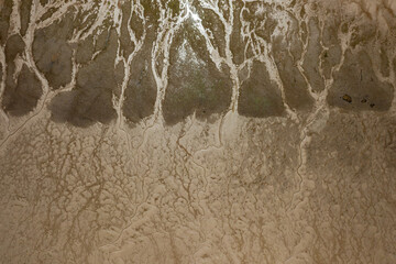 Abstract image in beige. aerial view of a river's delta at low tide
