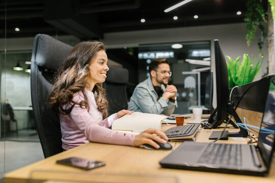 Co-workers Working On Their Computers