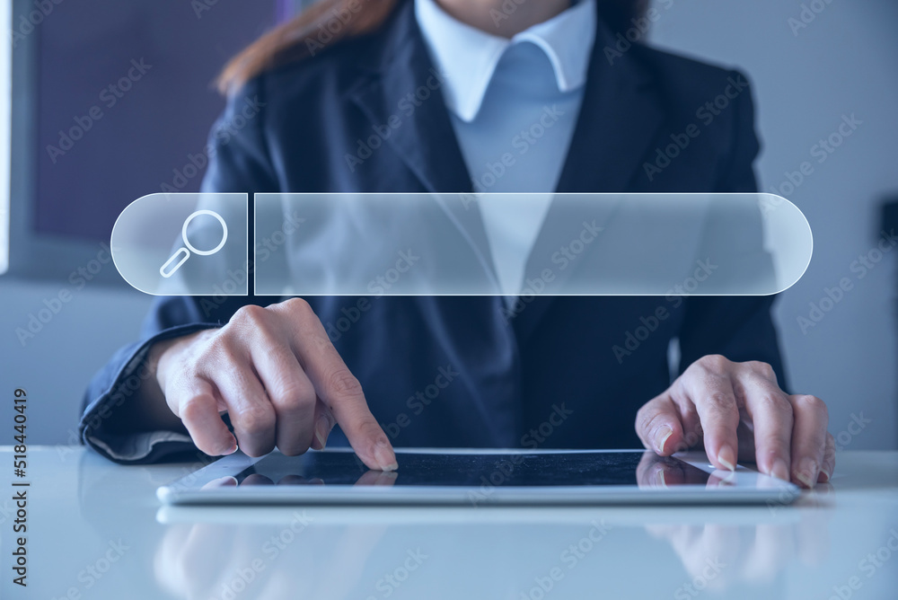 Poster a woman's hand is placed on a tablet with a search term box. using technology to find interesting in