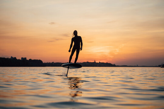 Surfer e-foil  sunset 