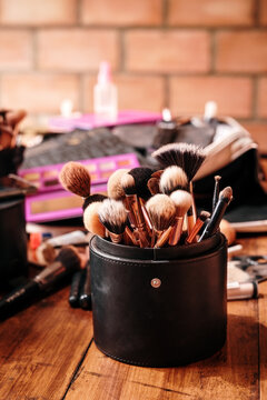 Case with makeup brushes on a table