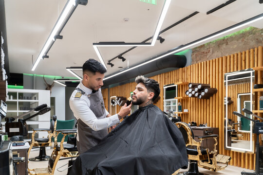 Barber Working With Client