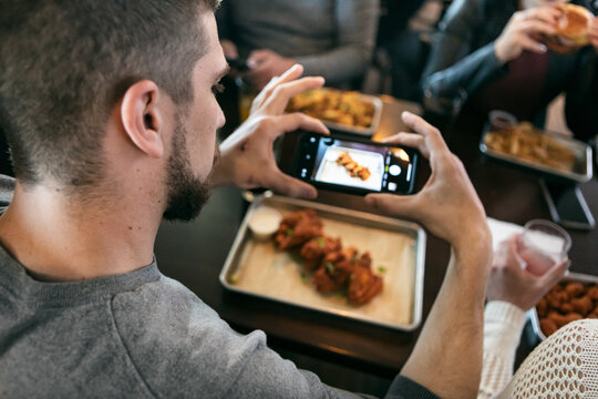 Brewery: Guy Takes Photo Of Chicken Wings With Smart Phone