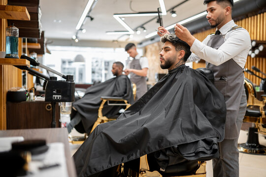 Hair Stylists Working With Their Clients