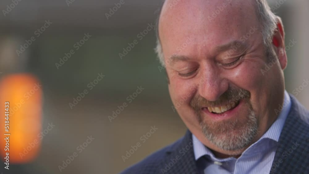 Aufkleber close up of man reading text message and smiling and laughing