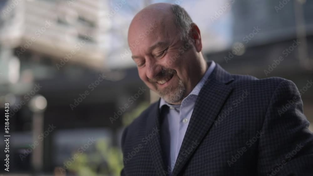 Poster close up of man reading text message smiling, laughing and then looking up thoughtfully