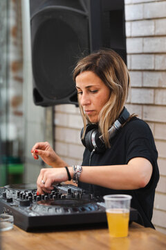 Young female disc jockey