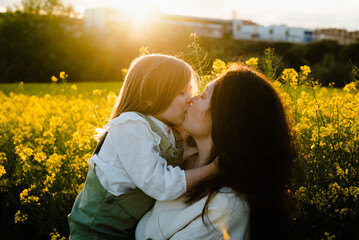 Mom Kissing Daughter