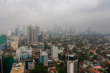Aerial view of city of Colombo with skyscrapers in the fog.