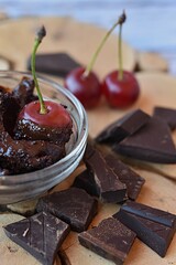 red cherry in chocolate chips and dark chocolate pieces. dessert