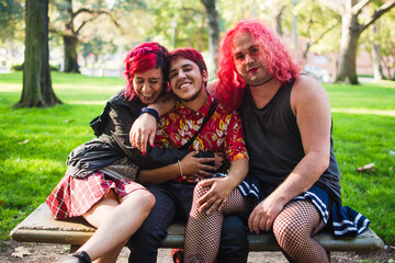 Group of transgender friends sitting in a park