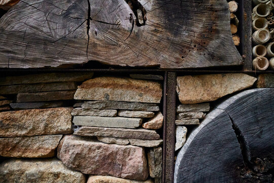 Layers of natural stone and wood used for insect hotel