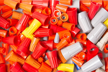 Many colored wire nuts on white background , Tool for connecting electrical wires.