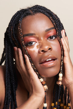 Peaceful Strong Young Black Woman Gazes At Camera With Parted Lips