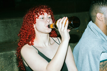 Young woman drinking on a night out