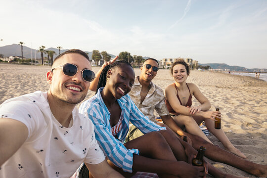 Selfie of Happy multi-ethnic friends enjoying on the beach