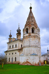 The bell tower of the white stone cathedral