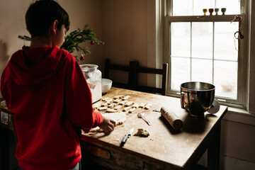 boy making shortbread cookies for Christmas 