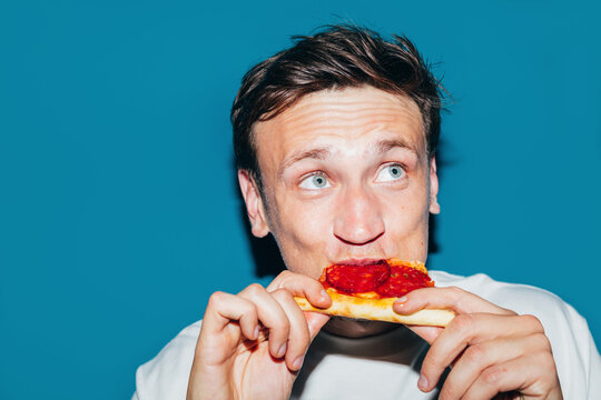 Man Eating Pizza Slice