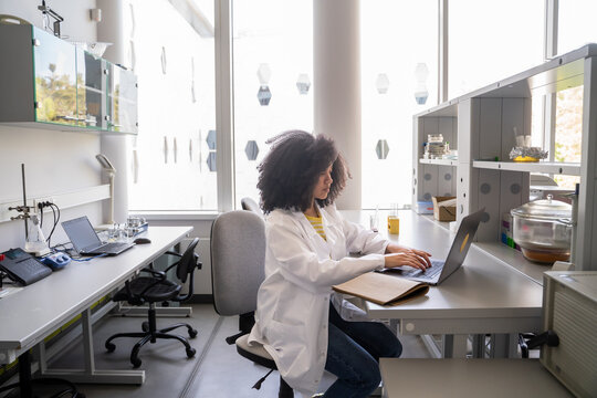 Using Laptop And Notebook In Laboratory