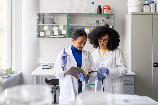 Researchers Working With Data In Lab