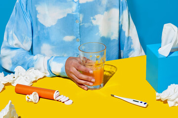 Crop sick woman taking carbon tablets