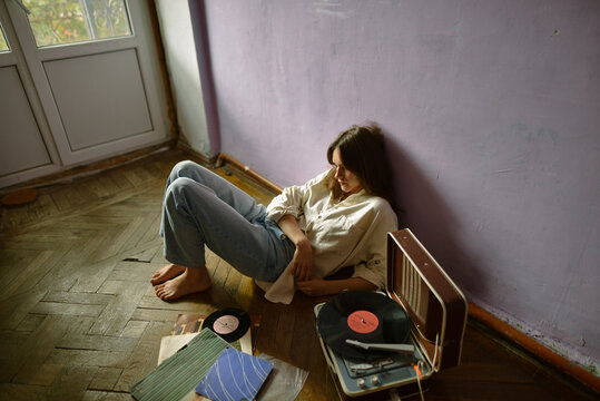 
girl listening to a record

girl listening to music
