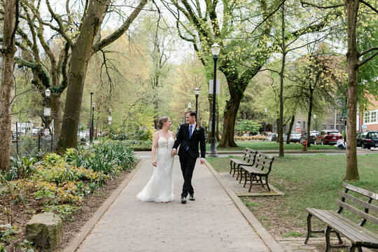 Bride and Groom Strolling in City Park