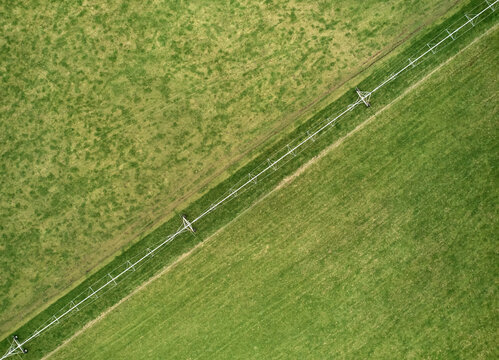 Deforestation for agriculture; irrigation pipes across frame diagonal