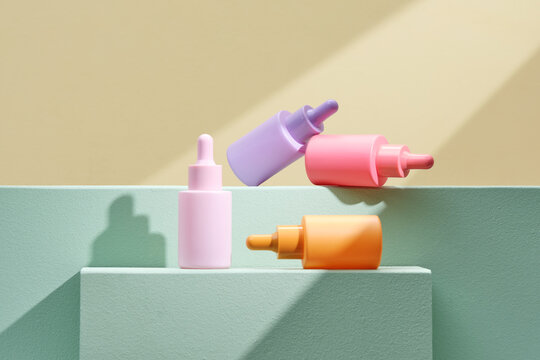 multitude of plastic color bottles on pastel color