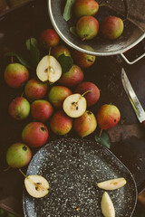 Scattered pears on a wooden table, harvesting.
