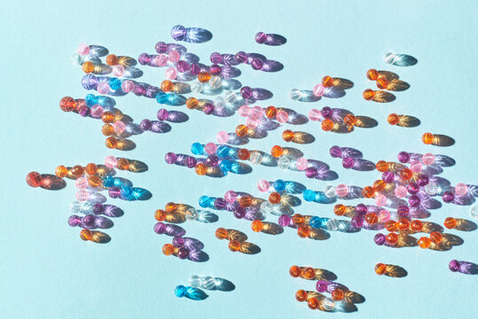 Various colorful beads on blue background