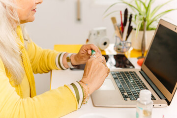 Anonymous businesswoman at her desk