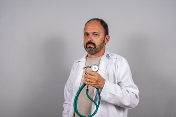 Portrait of mature senior doctor man holding stethoscope