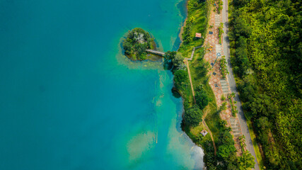 Aerial drone view of lake scenery with turquoise water in Tasik Puteri, Bukit Besi, Terengganu, Malaysia.
