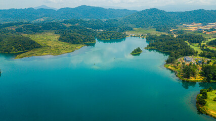 Fototapeta na wymiar Aerial drone view of lake scenery with turquoise water in Tasik Puteri, Bukit Besi, Terengganu, Malaysia.
