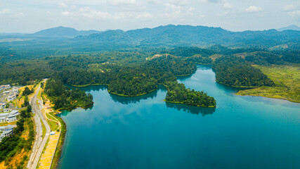 Aerial drone view of lake scenery with turquoise water in Tasik Puteri, Bukit Besi, Terengganu, Malaysia.