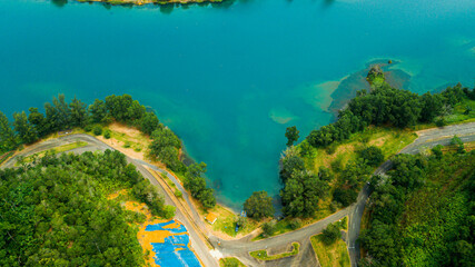 Aerial drone view of lake scenery with turquoise water in Tasik Puteri, Bukit Besi, Terengganu, Malaysia.