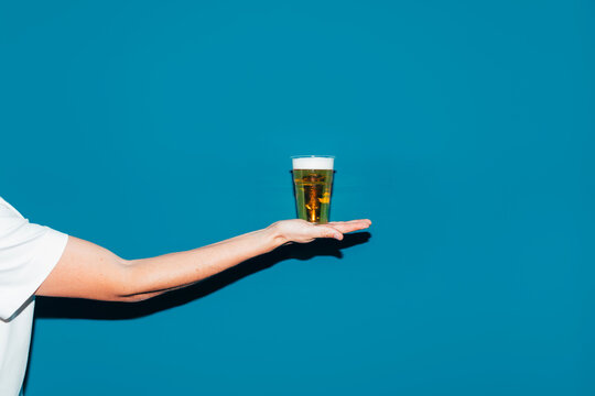 Man Holding Glass of Beer