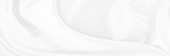 White gray satin texture that is white silver fabric silk background with beautiful soft blur pattern natural.