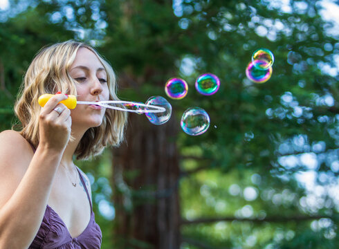 Female blowing bubbles
