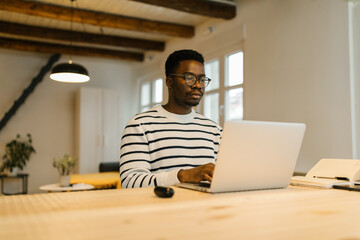 Millennial freelancer working online via computer