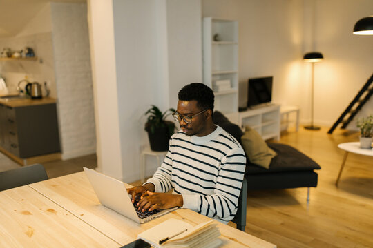 Man browsing via computer at home