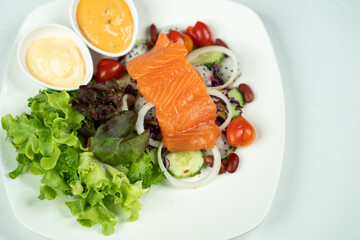 salmon salad white background 
with vegetables