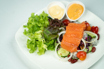 salmon salad white background 
with vegetables
