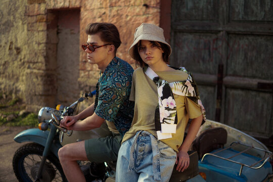 A stylish couple on the vintage motorcycle